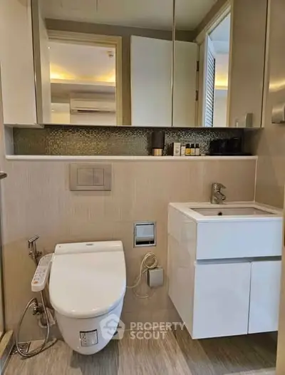 Modern bathroom with sleek fixtures and elegant design in a luxury apartment.