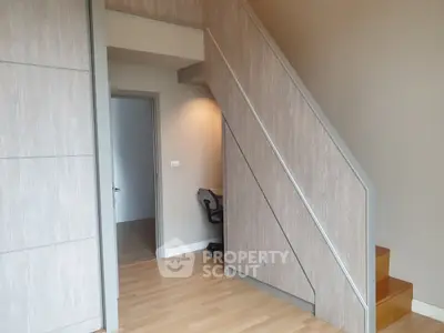 Modern interior with wooden staircase and sleek design
