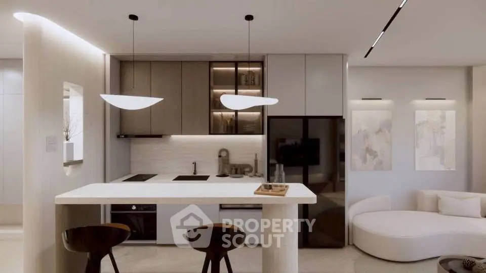 Modern kitchen with sleek design, featuring an open layout and stylish lighting fixtures.