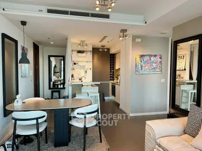 Modern open-plan living and dining area with stylish decor and contemporary kitchen.