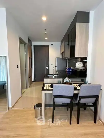 Modern kitchen with dining area in stylish apartment