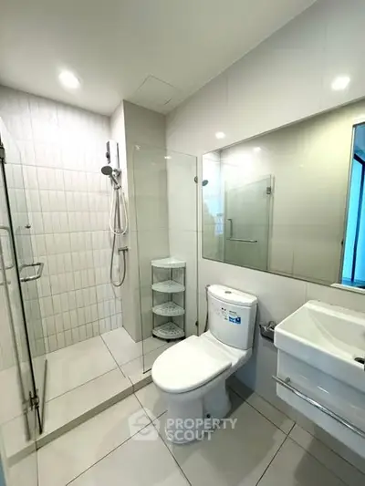 Modern bathroom with glass shower and sleek fixtures