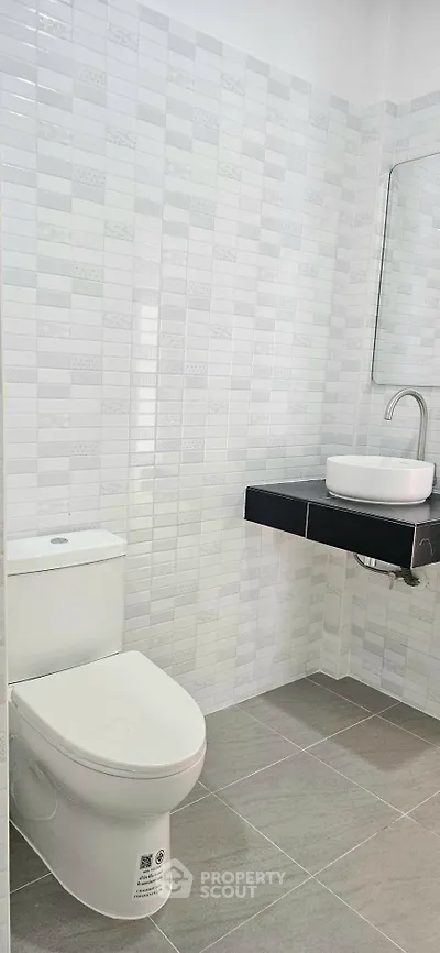Modern bathroom with sleek fixtures and stylish tile design