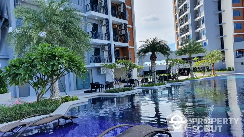 Luxurious apartment complex with stunning pool and lush landscaping