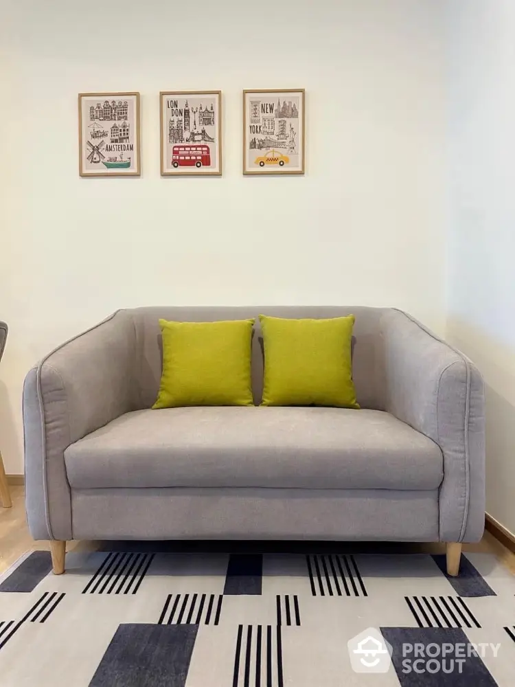 Stylish modern living room with gray sofa and vibrant decor accents