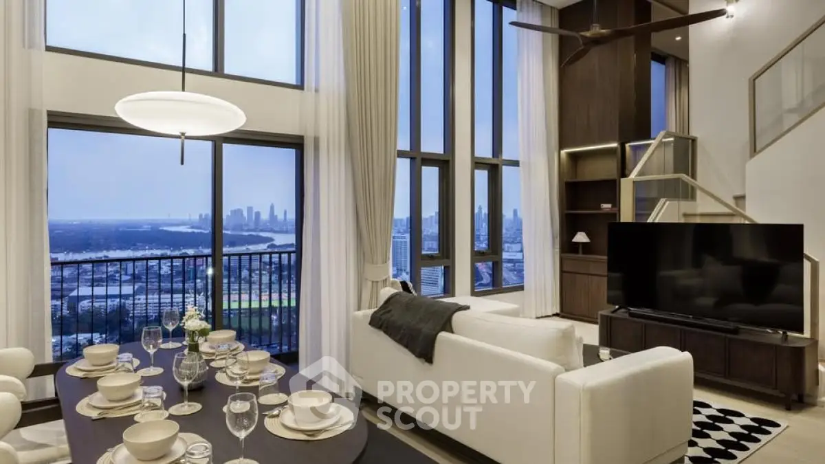 Luxurious high-rise living room with stunning city view and elegant decor.