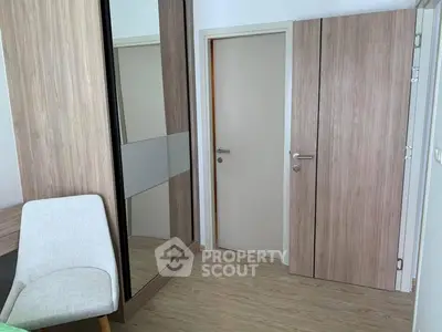 Modern bedroom with wooden wardrobe and sleek design