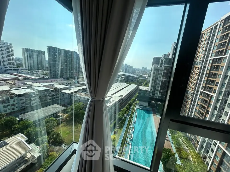 Stunning high-rise apartment view with pool and cityscape, perfect for urban living.