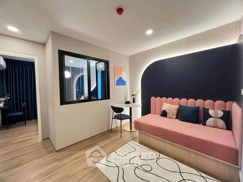 Modern living room with stylish decor and cozy seating area, perfect for relaxation and entertaining.