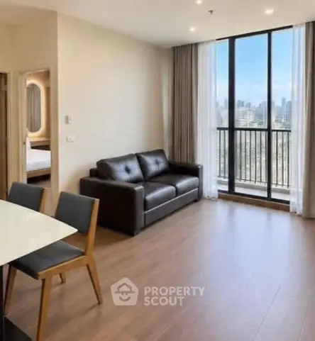 Spacious modern living room with city view and elegant furnishings