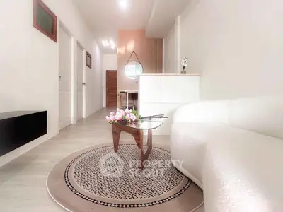 Modern living room with elegant decor and cozy seating area, perfect for relaxation and entertaining.