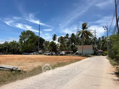 Prime land plot with road access and tropical surroundings, ideal for development opportunities.