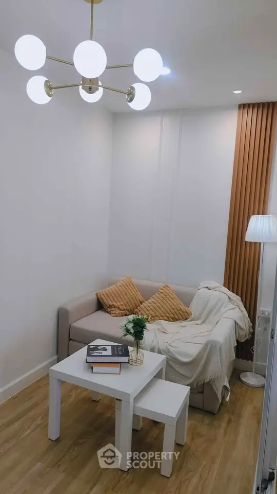 Cozy living room with modern lighting and stylish decor