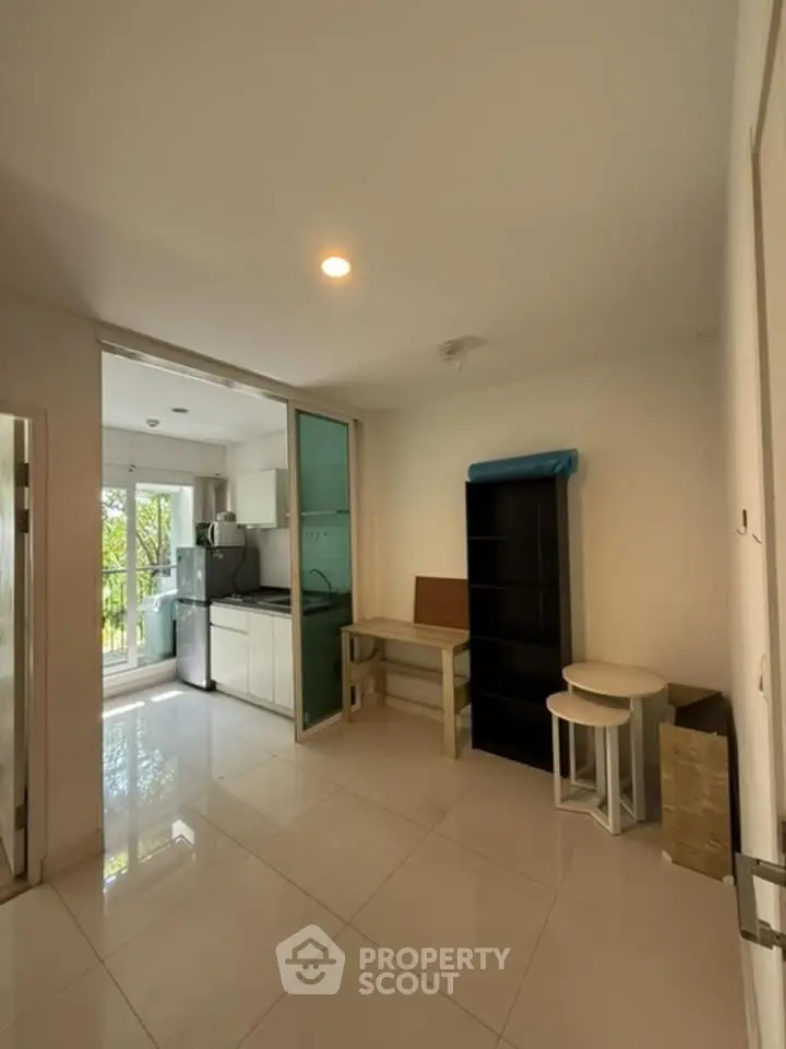 Spacious modern apartment with open kitchen and bright natural light.