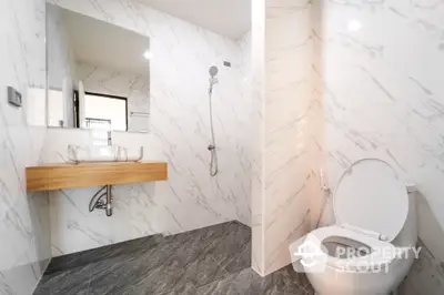 Modern bathroom with elegant marble tiles and sleek fixtures