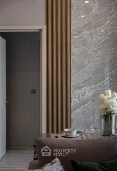 Elegant modern interior with marble wall and cozy dining setup