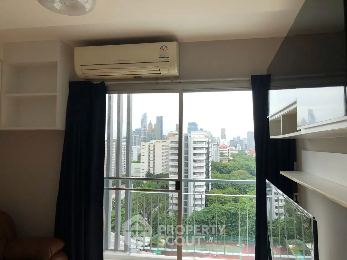 Modern apartment with balcony offering stunning city skyline view