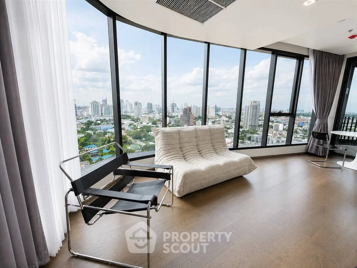 Luxurious corner unit with panoramic city views and modern furnishings.