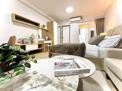 Modern bedroom with cozy decor and stylish furniture, featuring a comfortable bed and elegant design.