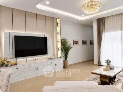 Luxurious living room with elegant decor, large TV, and natural light from floor-to-ceiling windows.