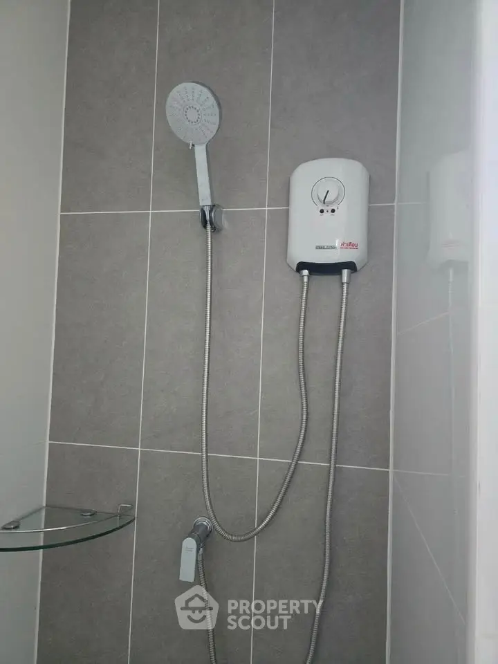 Modern bathroom shower with sleek design and water heater installation.