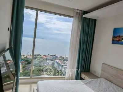 Stunning bedroom with panoramic ocean view and modern decor