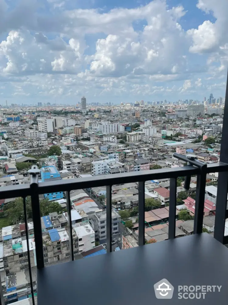 Stunning cityscape view from a high-rise balcony with expansive skyline.