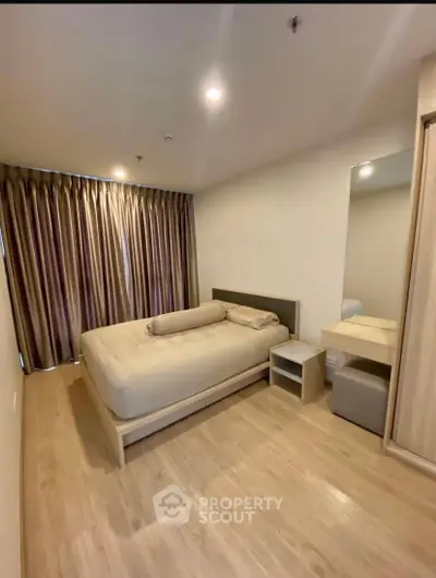 Spacious modern bedroom with elegant decor and natural light
