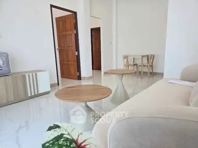 Modern living room with minimalist furniture and elegant wooden accents