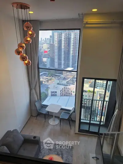 Modern high-rise apartment with floor-to-ceiling windows and city view, featuring stylish lighting and cozy seating area.