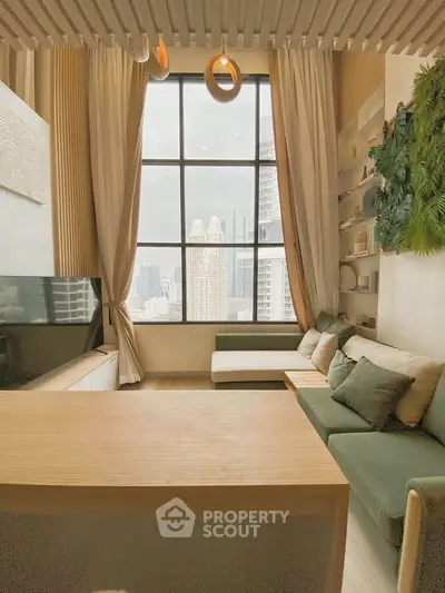 Modern living room with large window and city view, featuring stylish furniture and greenery.