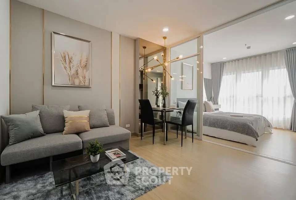 Modern open-plan living room with elegant decor and cozy bedroom view