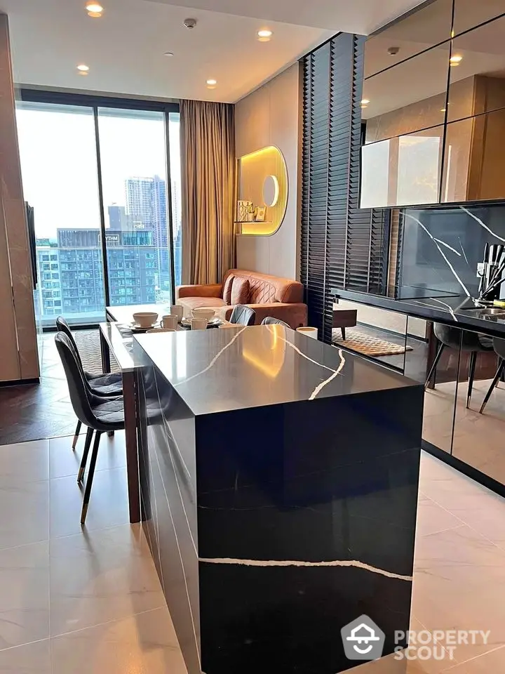 Modern open-plan kitchen with sleek black island and city view