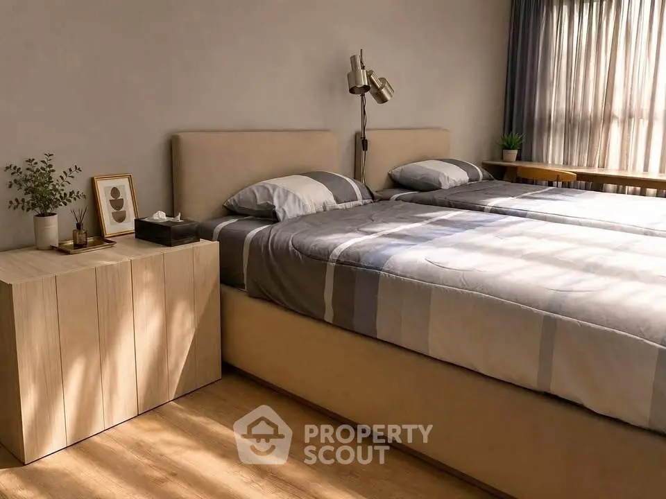 Cozy bedroom with stylish decor and natural light, featuring a comfortable bed and elegant furnishings.