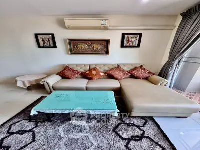 Stylish living room with elegant sofa and decor, perfect for relaxation and entertaining.