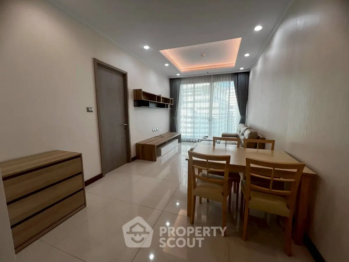 Modern living room with elegant furniture and ambient lighting, perfect for relaxation and entertainment.