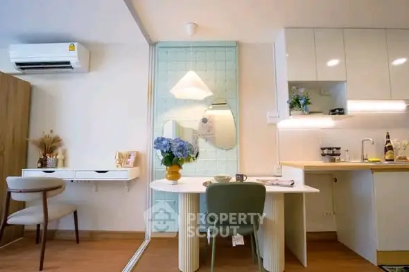 Chic modern living space with stylish dining area and compact kitchen, perfect for urban living.