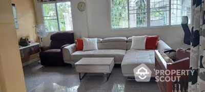 Spacious living room with modern sectional sofa and natural light