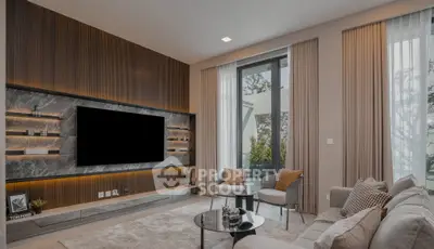 Luxurious modern living room with elegant decor and large TV, featuring floor-to-ceiling windows and stylish furniture.