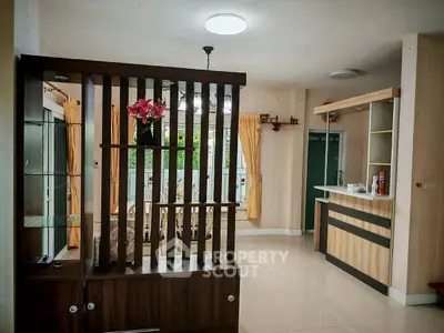 Spacious living room with modern partition and natural light