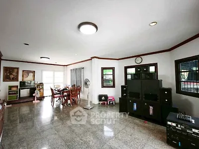 Spacious living room with modern decor and entertainment system