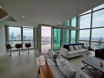 Luxurious corner unit with stunning city views and spacious living area in high-rise building.