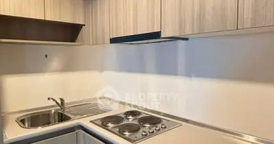 Modern kitchen with sleek cabinetry and electric stove