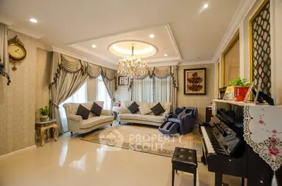 Luxurious living room with elegant decor, chandelier, and piano, perfect for sophisticated gatherings.