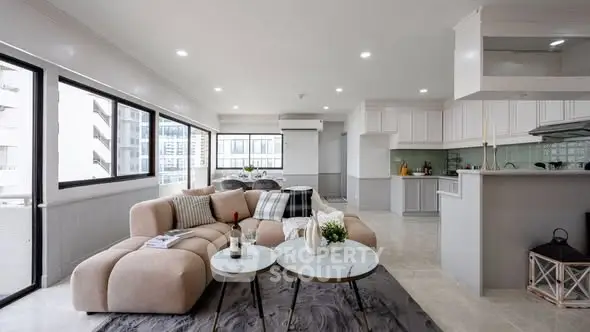 Spacious modern living room with open kitchen and large windows