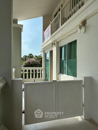 Charming balcony with scenic view, perfect for relaxation and enjoying nature's beauty.