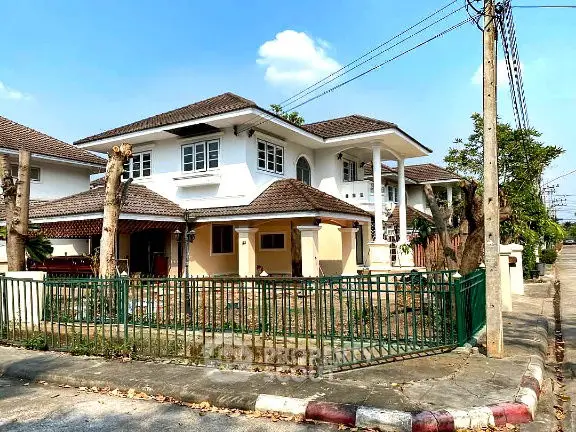 Charming two-story house with a spacious yard and classic architecture in a serene neighborhood.