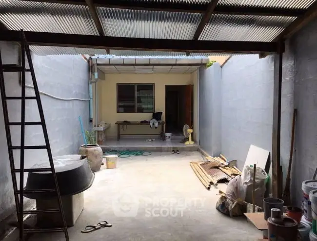 Spacious covered outdoor area with potential for renovation and customization.