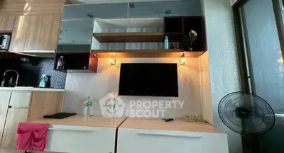 Modern living room with stylish cabinetry and wall-mounted TV