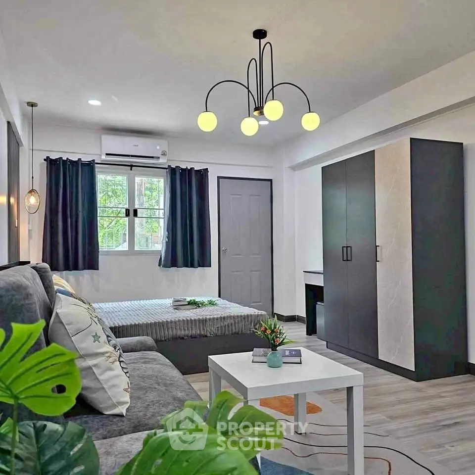 Modern living room with stylish lighting and cozy decor